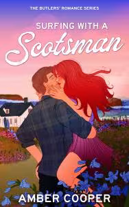 A man in a plaid shirt holds a red headed woman and kisses her in front of a cottage by the sea.